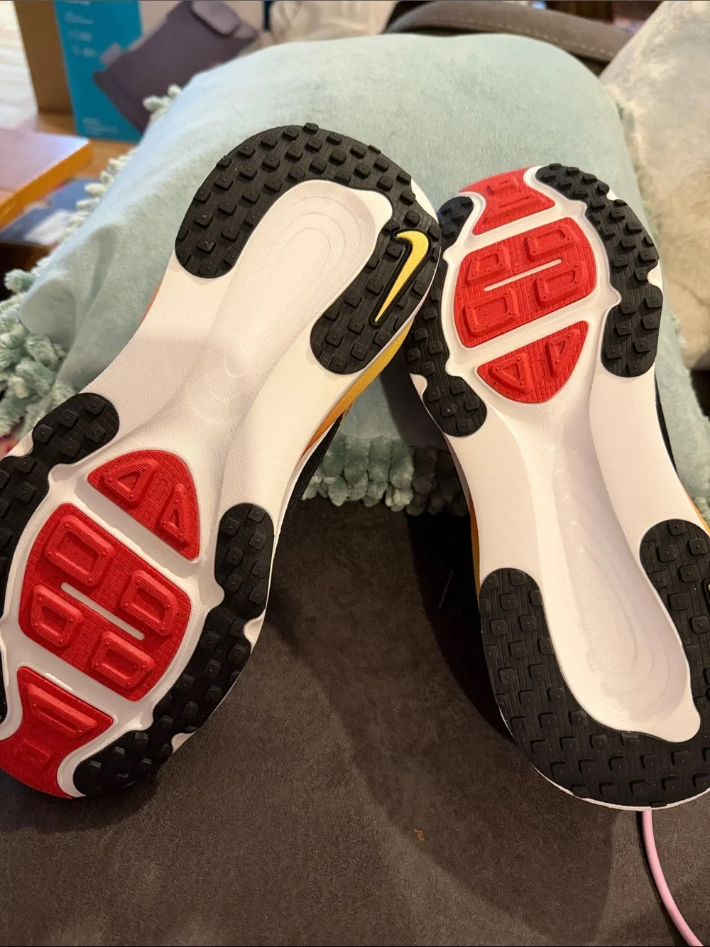 Nike Black Running Sneakers with Red and Yellow Accents