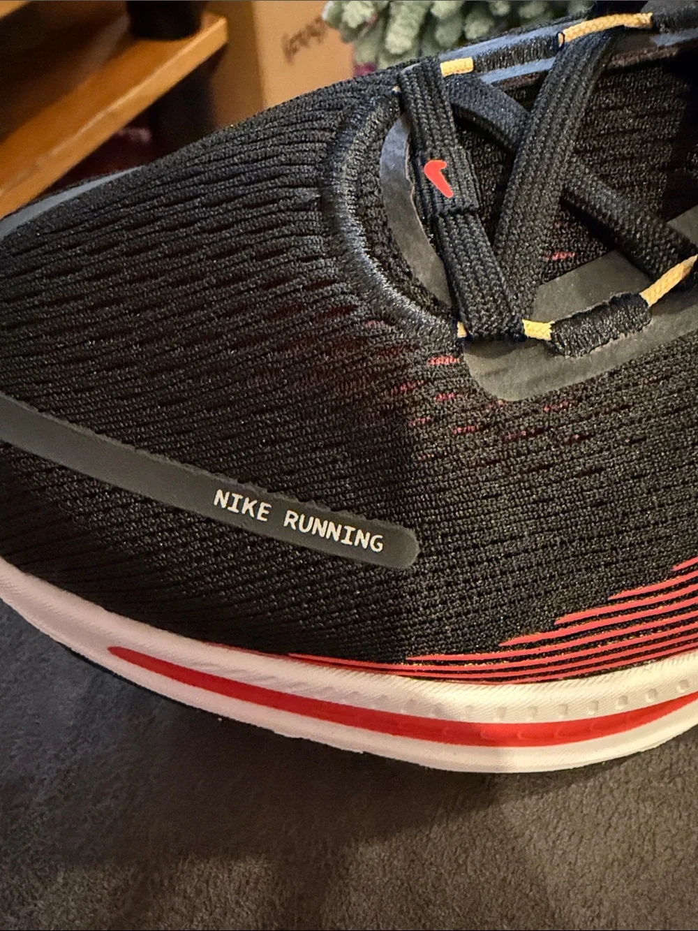 Nike Black Running Sneakers with Red and Yellow Accents