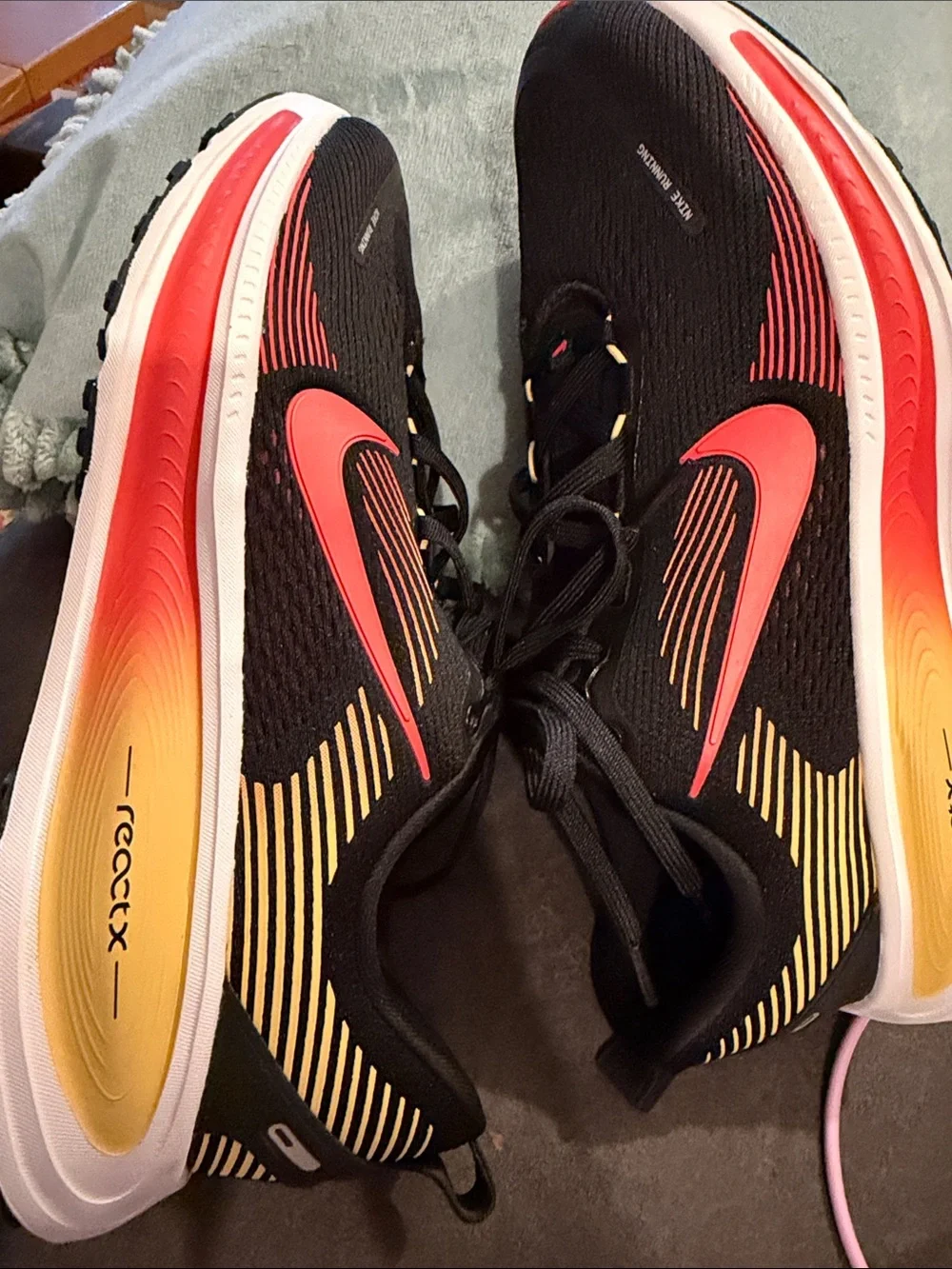 Nike Black Running Sneakers with Red and Yellow Accents