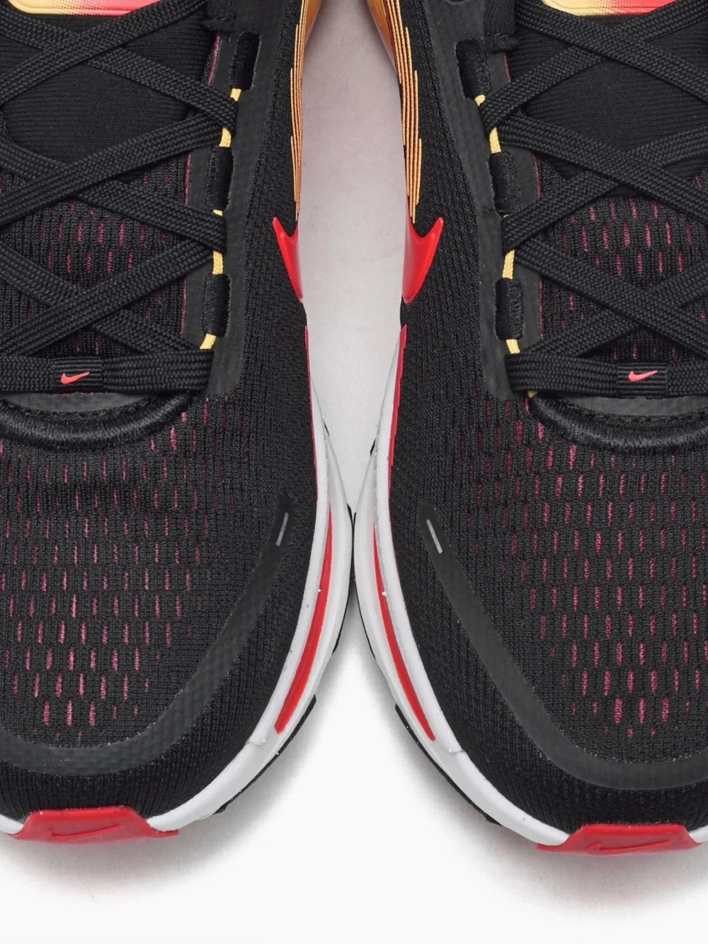 Nike Black Running Sneakers with Red and Yellow Accents